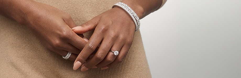 Close up of woman's hand wearing natural diamond jewelry Close up of woman's hand wearing natural diamond jewelry